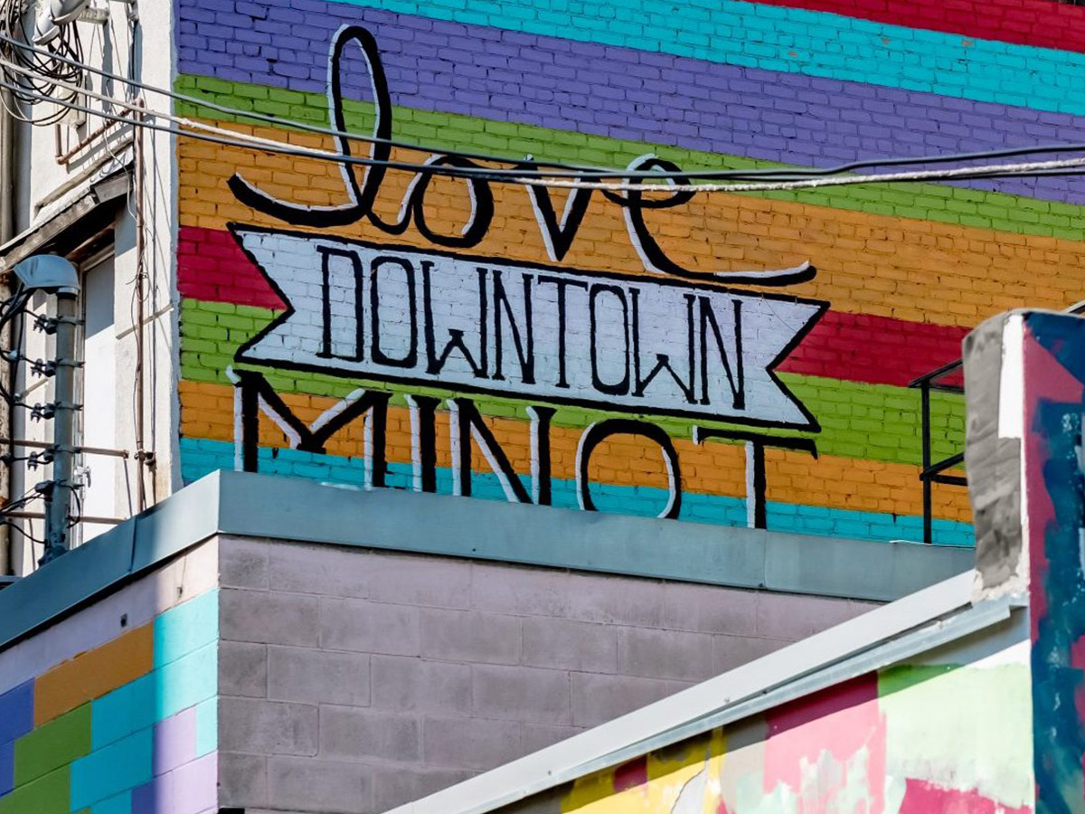 Photo of mural on outside wall that says Love Downtown Minot