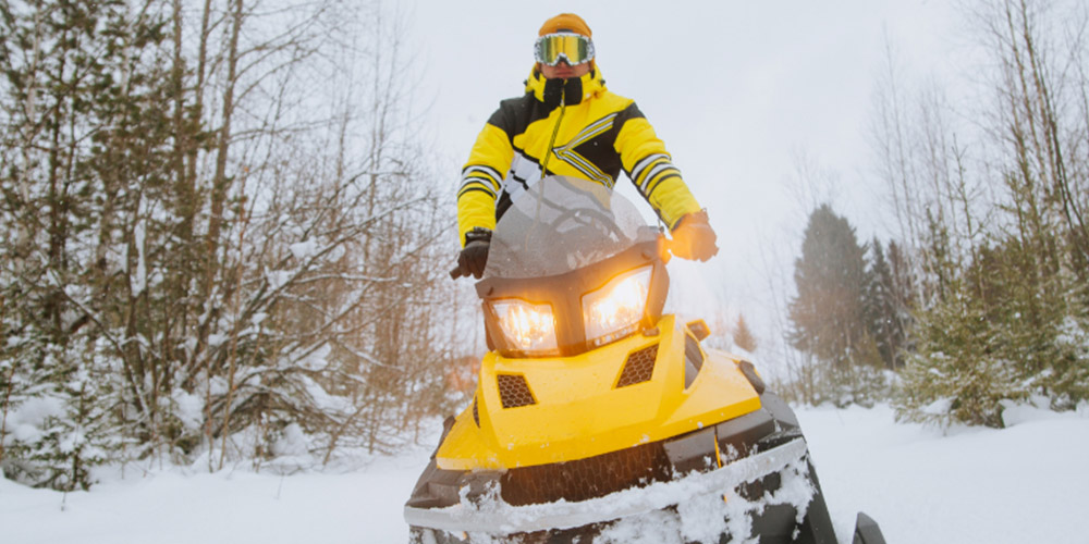 Photo of yellow snowmobile