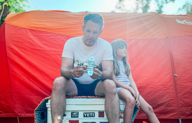 Dad and Daughter in front of a tent